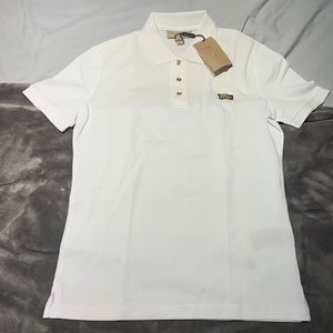 Burberry white polo with gold accents
